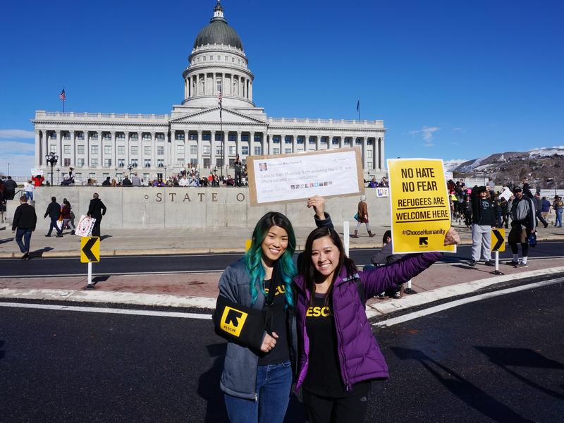 Peaceful marchers stand holding signs before the Utah State Capitol Peaceful marchers stand holding signs before the Utah State Capitol