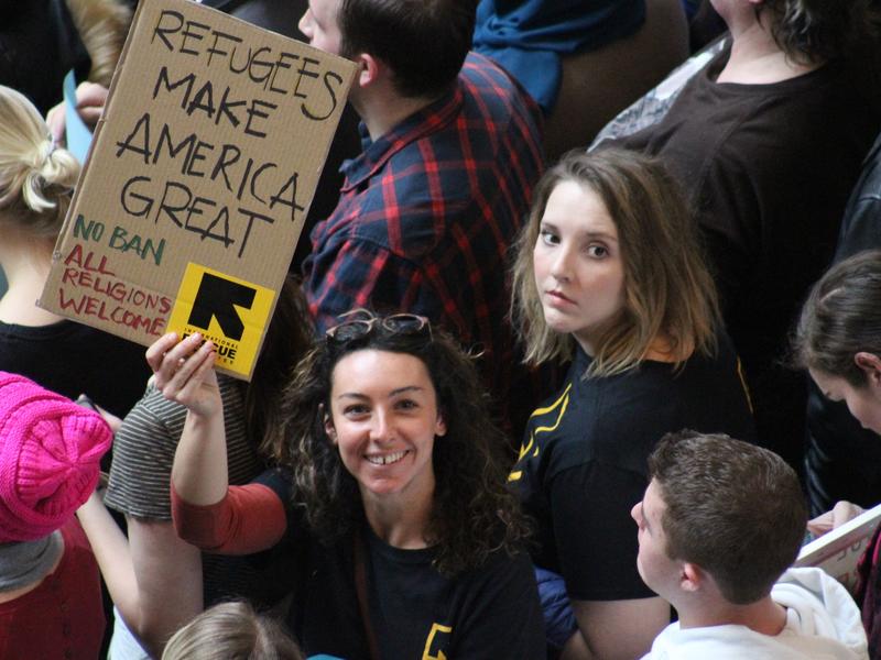 IRC staff member holds sign during Utah March for Refugees IRC staff member holds sign during Utah March for Refugees