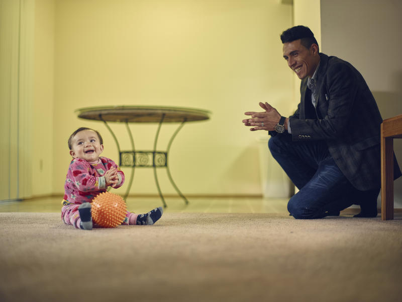 Father with his son inside apartment Adil with his son Steven inside their apartment