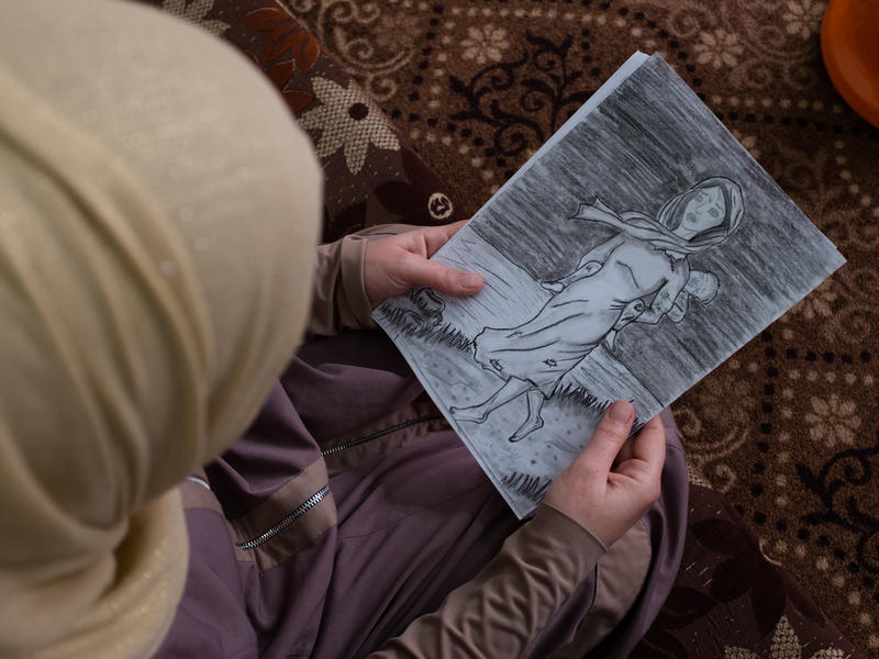 Syrian woman with a drawing Syrian woman with a drawing