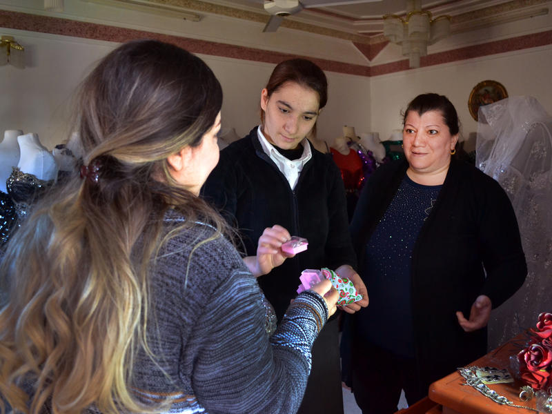Linda and her 16-year-old daughter Mimi at the couture shop in Telskof Linda and her 16-year-old daughter Mimi talk to a customer.