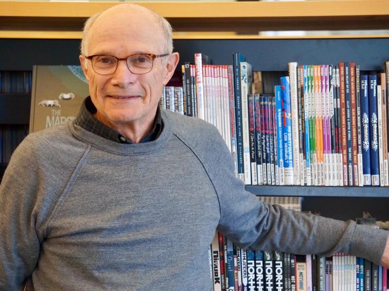 Eric Goldman has volunteered with the IRC in Salt Lake City since 2016. Eric Goldman, an ESL volunteer at the IRC in Salt Lake City, stands in the library after an ESL class.