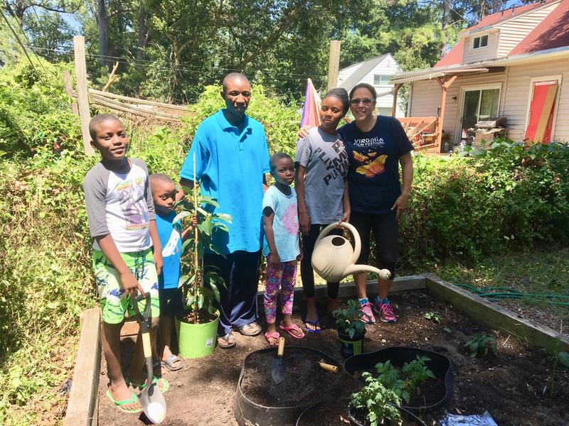 Roberta and the Sungula family in their new garden.