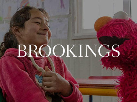 Sesame Street Muppet Elmo and a Syrian refugee girl, part of Sesame Workshop and the IRC's Ahlan Simsim early education program for refugees