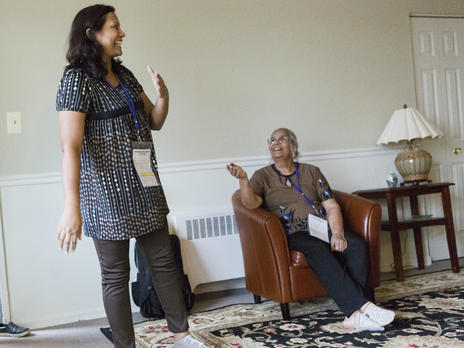 A mother and daughter from Pakistan arrive at their home furnished by volunteers A refugee mother and daughter from Pakistan take in their new, furnished apartment