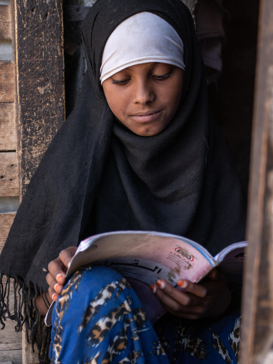 Aisha reading a book