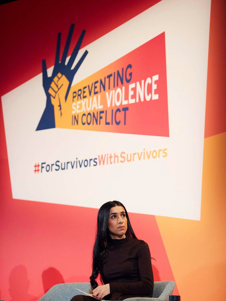 Nadia sat down, while giving a talk at a preventing violence in conflict event.