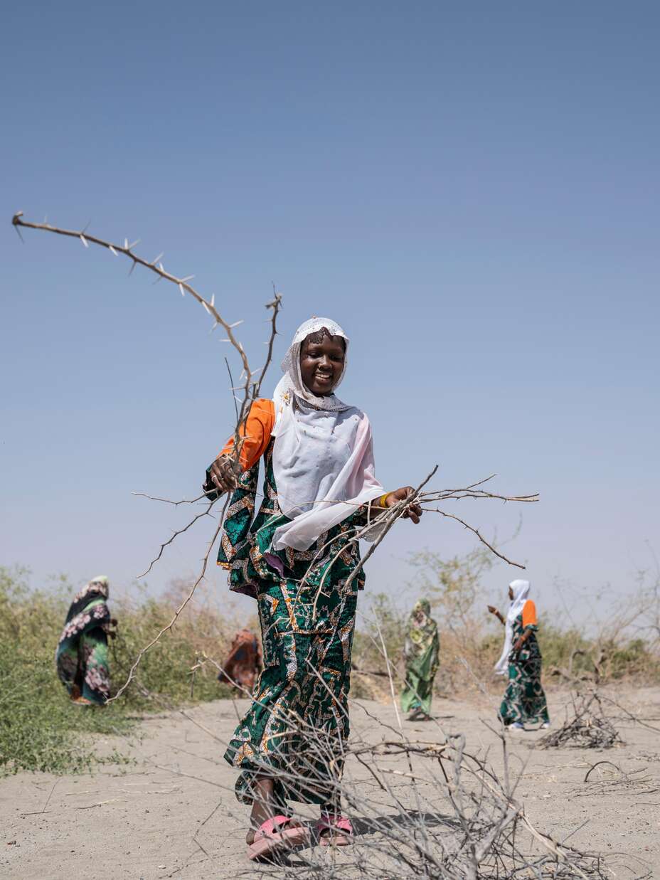 Yangou and her friends from Girl Shine collect firewood together—a routine that also serves as a safety strategy. 