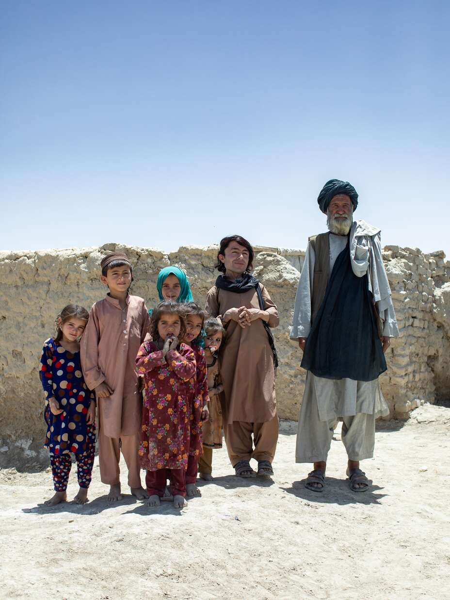 Darweza, with his 71-year-old father, Hayat Khan, and his nieces and nephews at their home. 