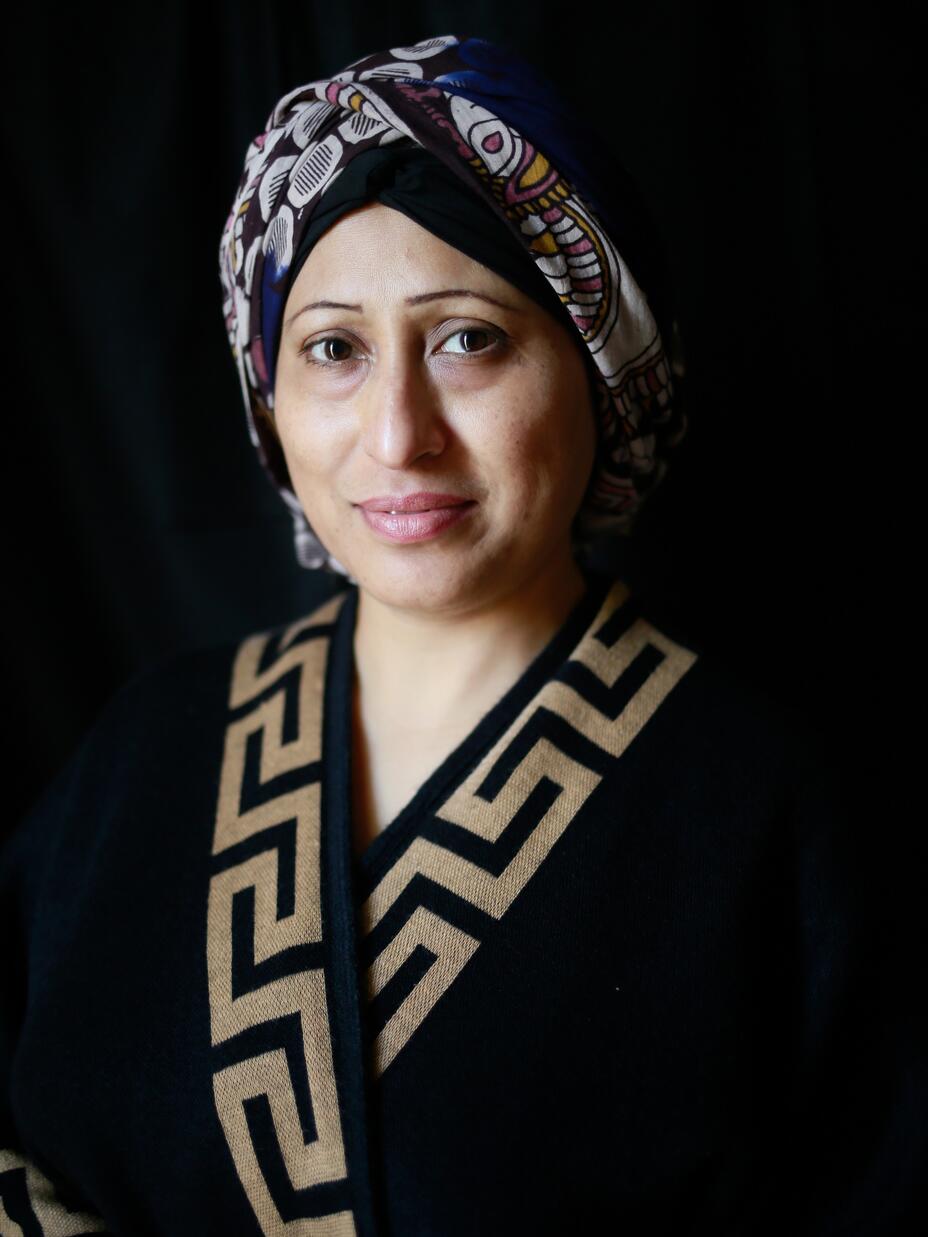 Razia Sultana portrait against black backdrop 