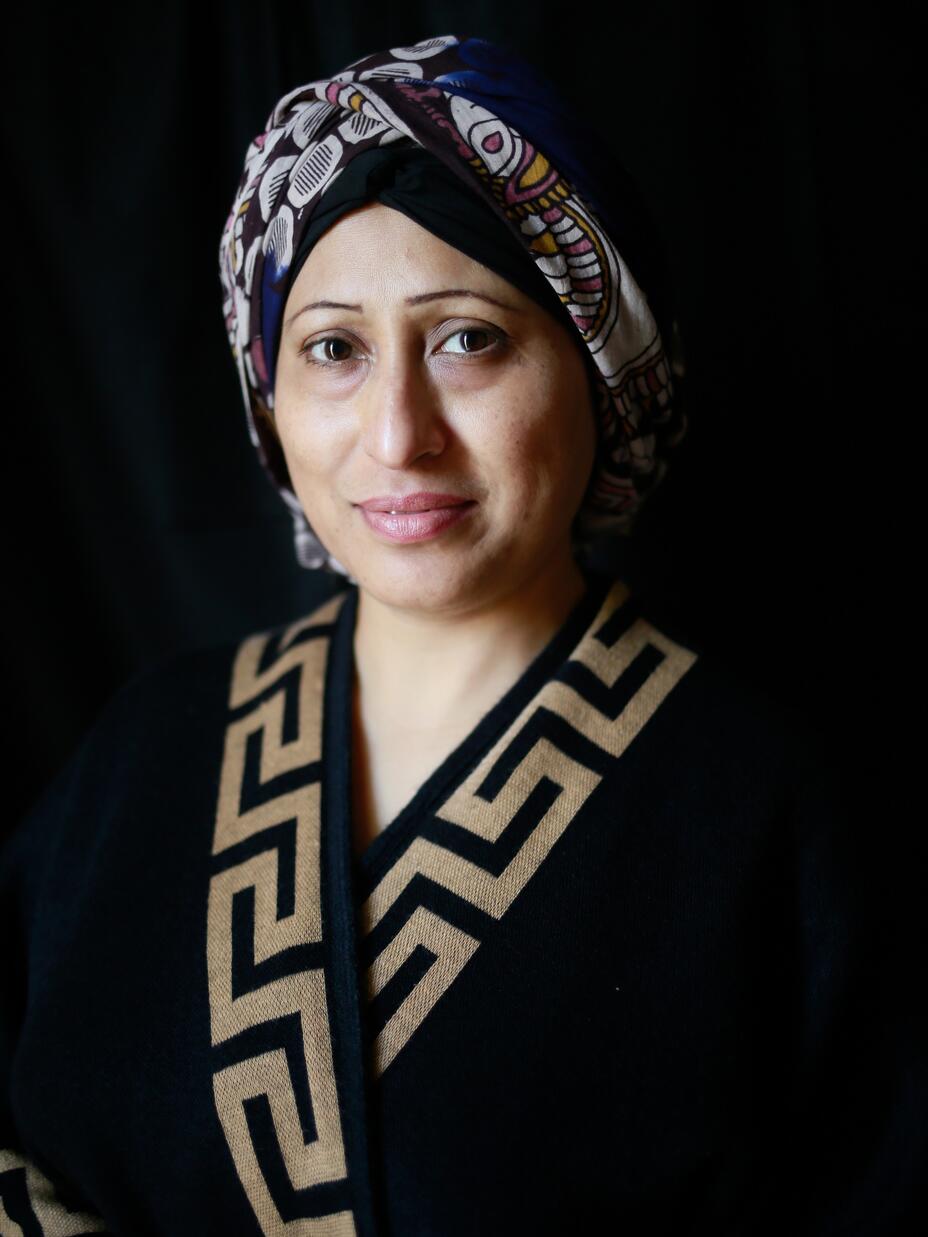 Razia Sultana portrait against black backdrop