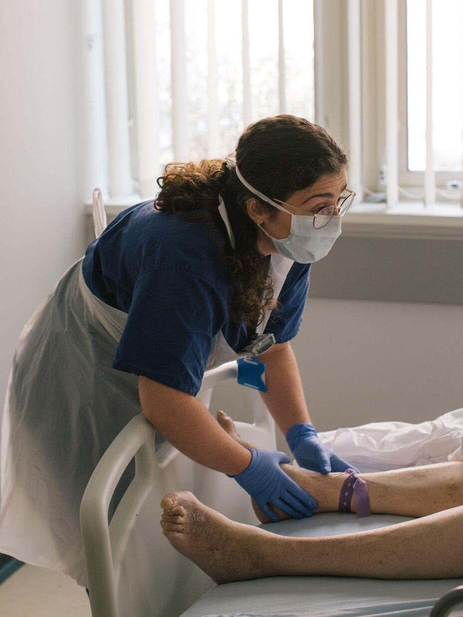 Anxhela Gradeci attends to a patient