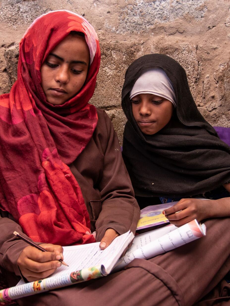 Aisha and Na’aem studying