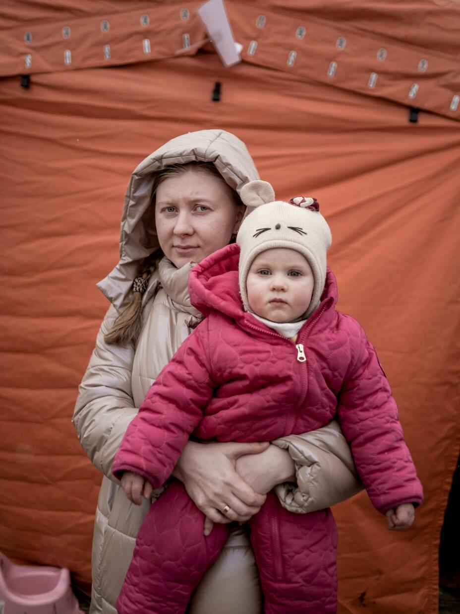 A Ukrainian woman holding an infant