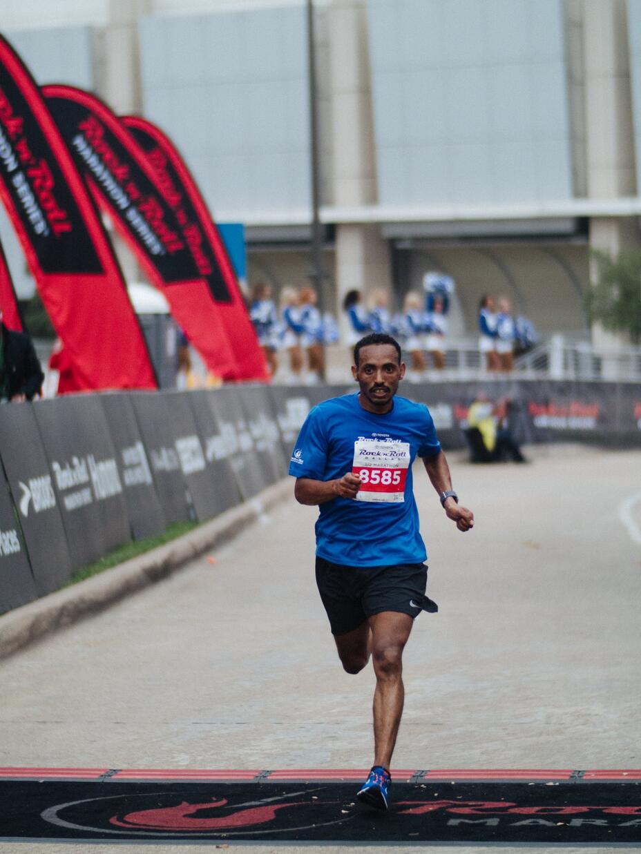 Tolassa crosses the finish line