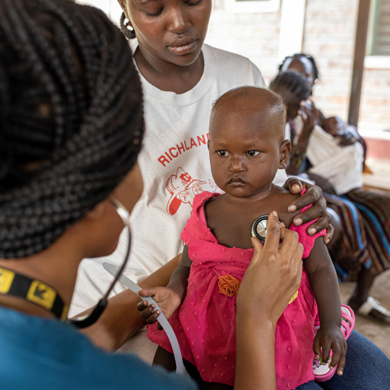 Dr. Sila Monthe, 29, health manager for IRC at Kakuma, checks Vanessa,1, for malnutrition at Locher Angamor Health Dispensary in Kakuma Refugee Camp