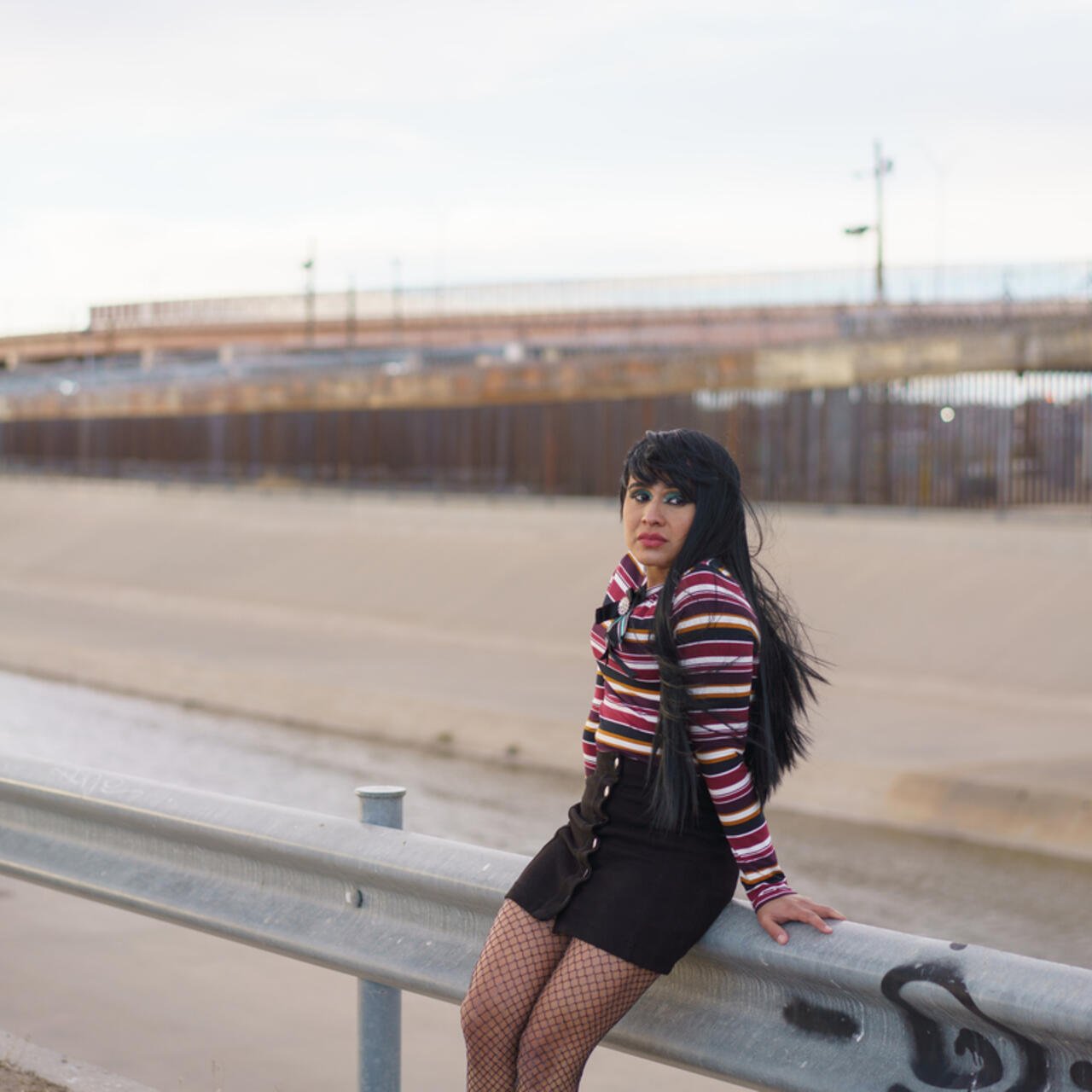 Image of Fernanda standing against a guard rail