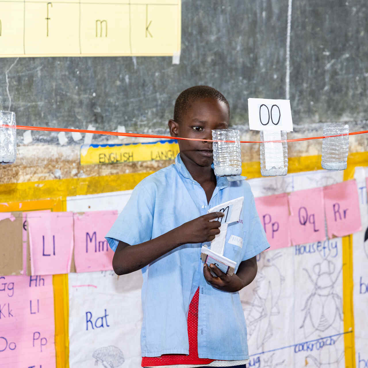 A young boy leads a class room activity in a PlayMatters program.