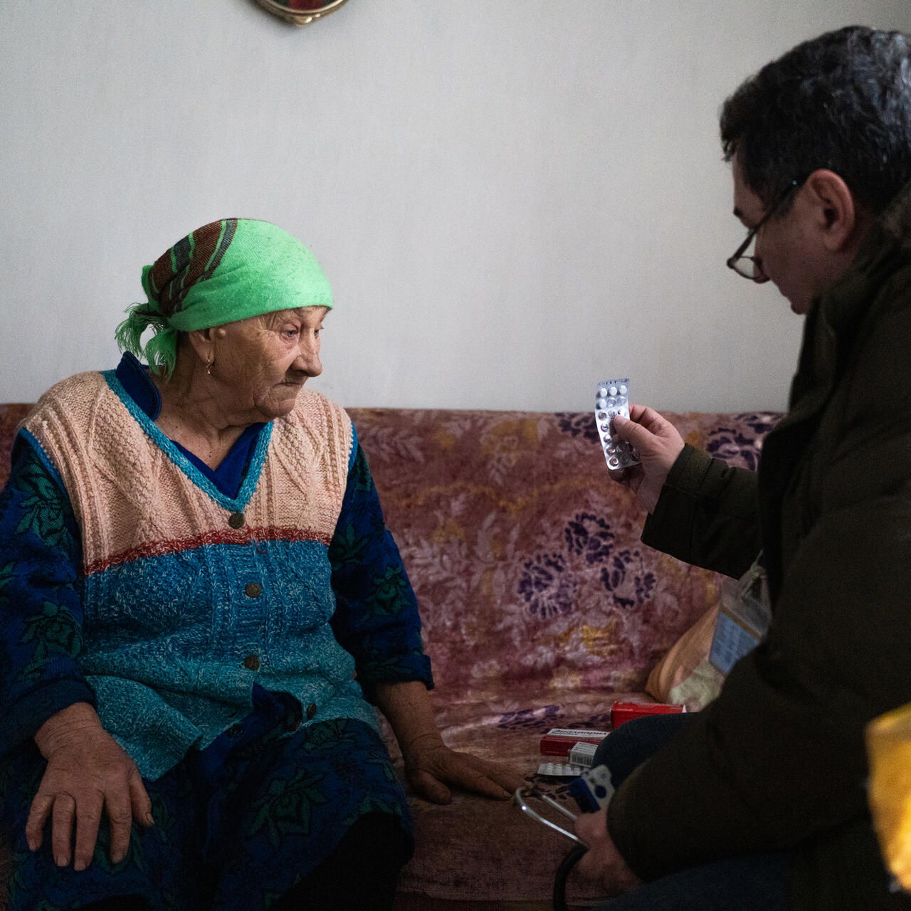 Dr. Oleg and community mobilizer Darina Holub pose with patient Lidia. 