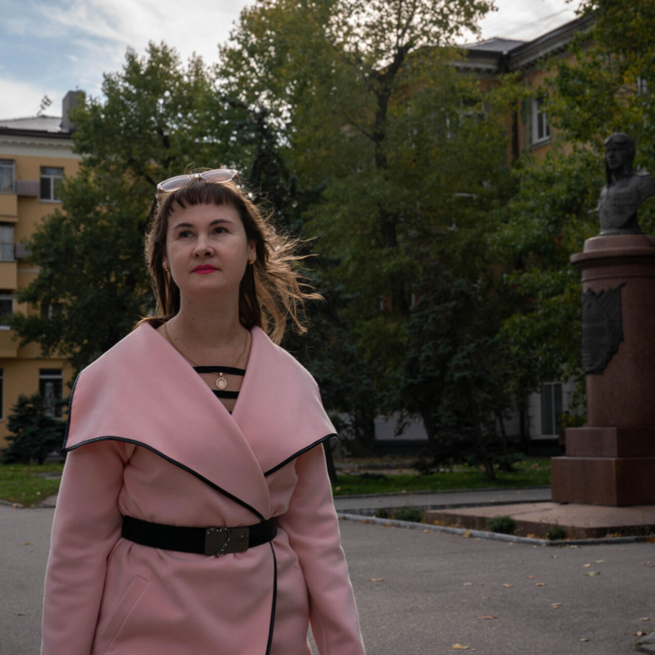 Ukrainian woman walking down the street towards a new work opportunity.