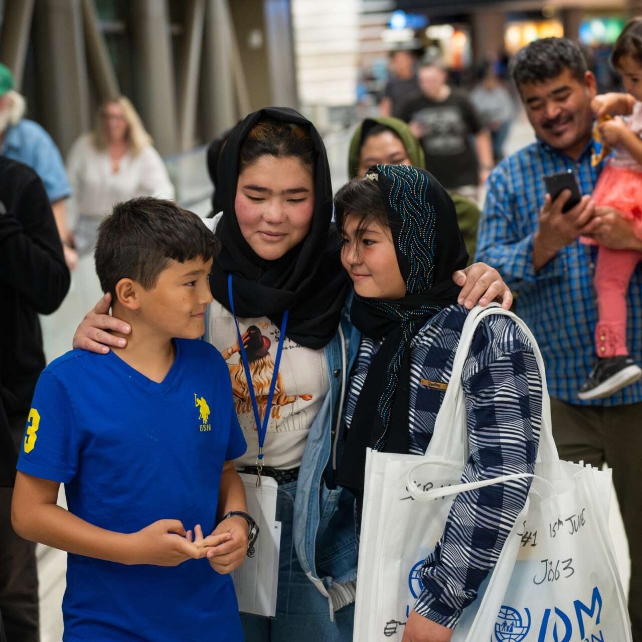 An Afghan family embraces after their reunited for the first time in years at the Salt Lake City Airport.