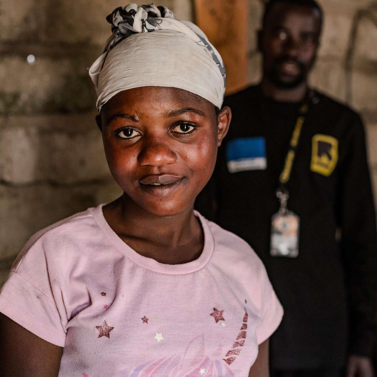 Gentille looks at the camera, smiling.  