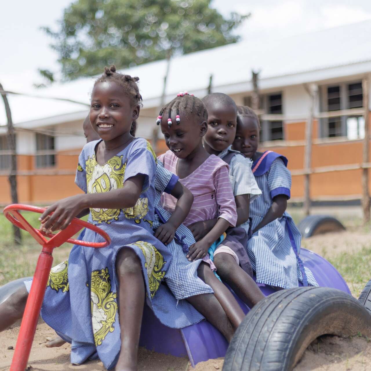 Five children play at a playground in Ethiopia.
