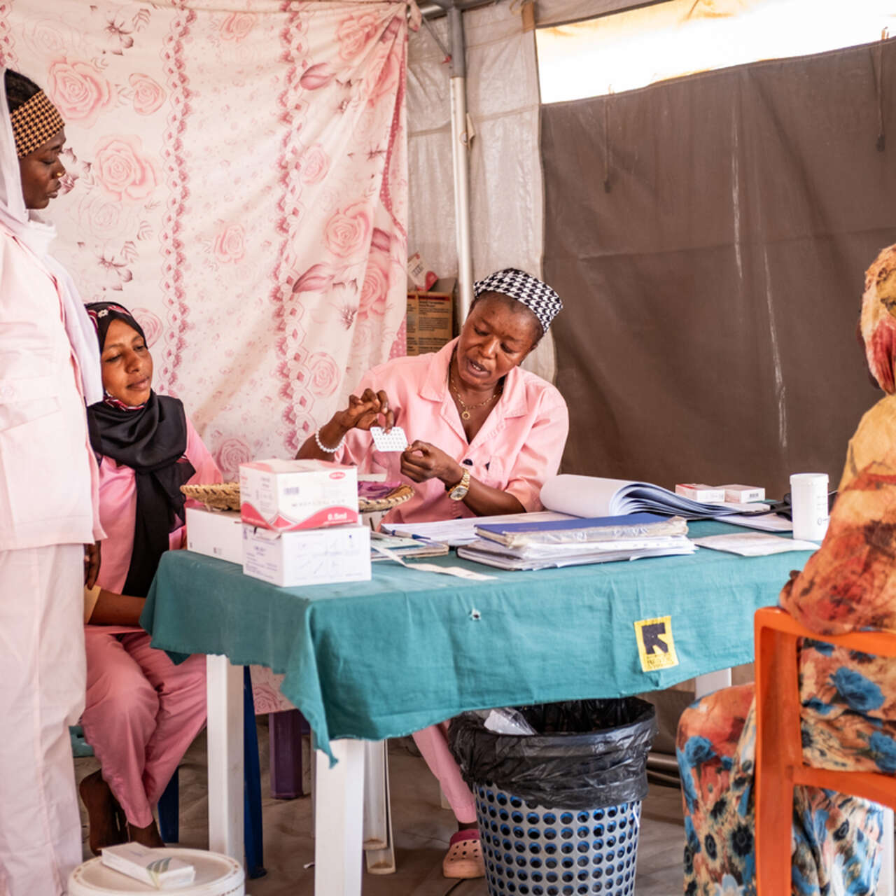 IRC mid wives; Darassalam Adoud (26), Njdepa Dingatoloum (32) and Sadia Acyl (26) during antenatal session with Mariam* at Materity Ward in IRC clinic in Aboutengue refugee camp.