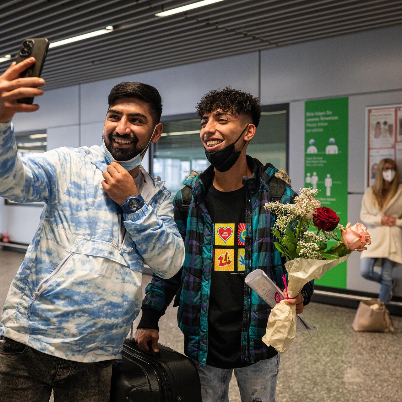 Afghan refugee brothers Ali, 17, and Mehdi, 29, take a selfie photo together after being reunited at the Frankfurt, Germany airport.