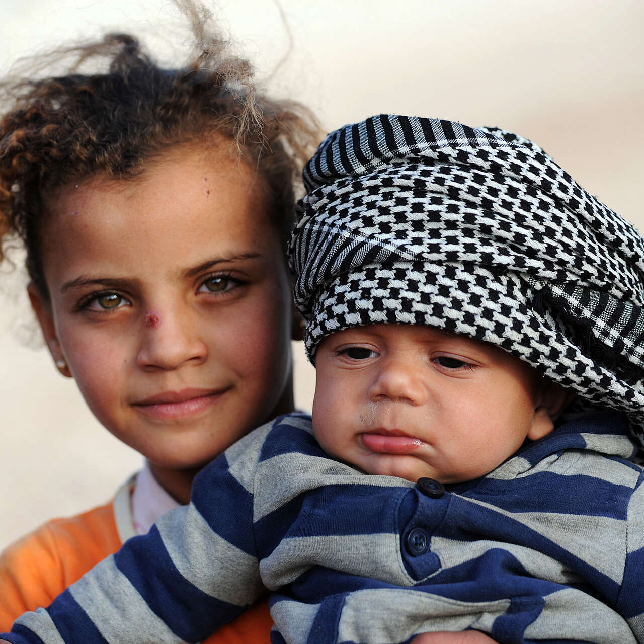 Two Syrian refugee children in Zaatari camp, northern Jordan. 