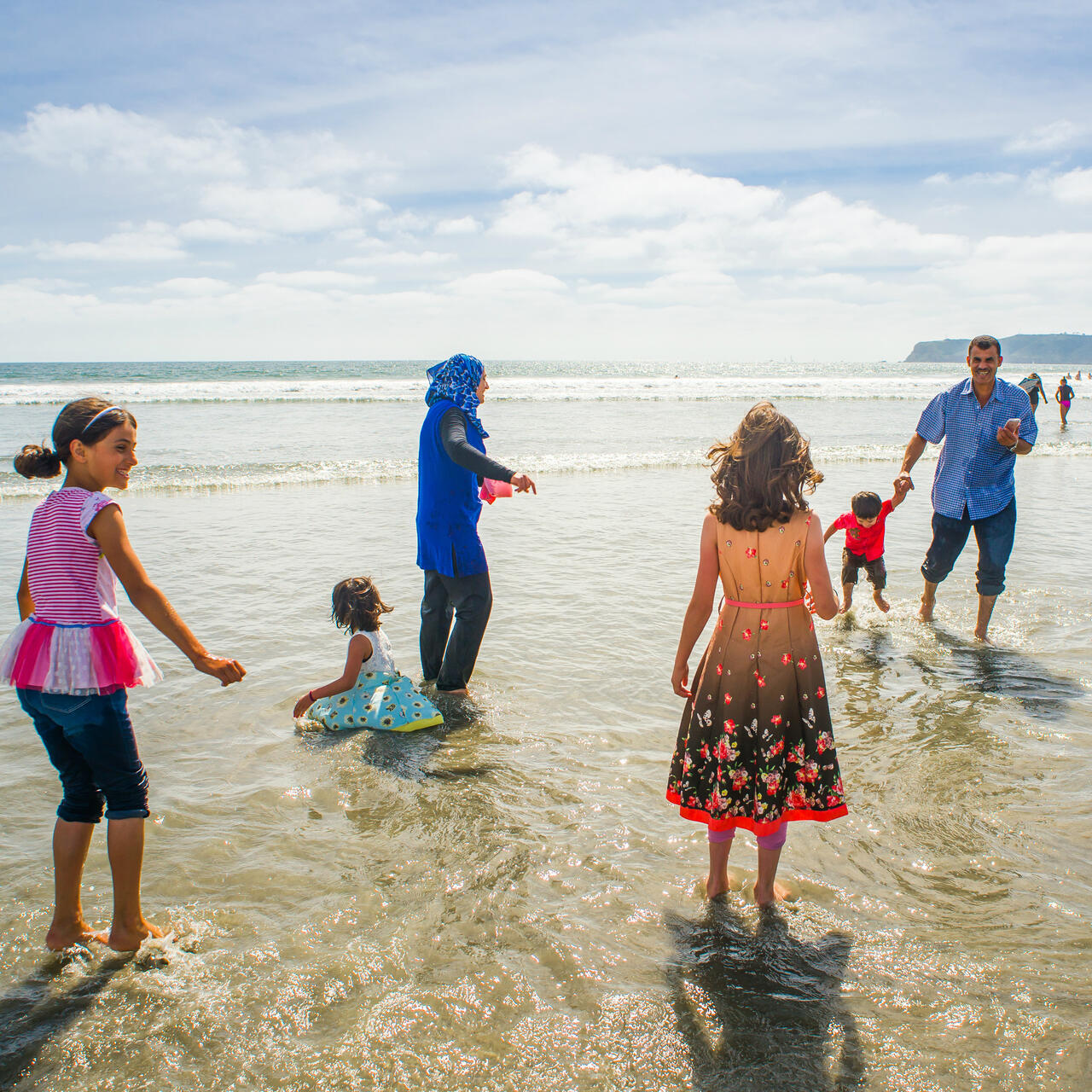 The Tlas family from Syria on a California beach