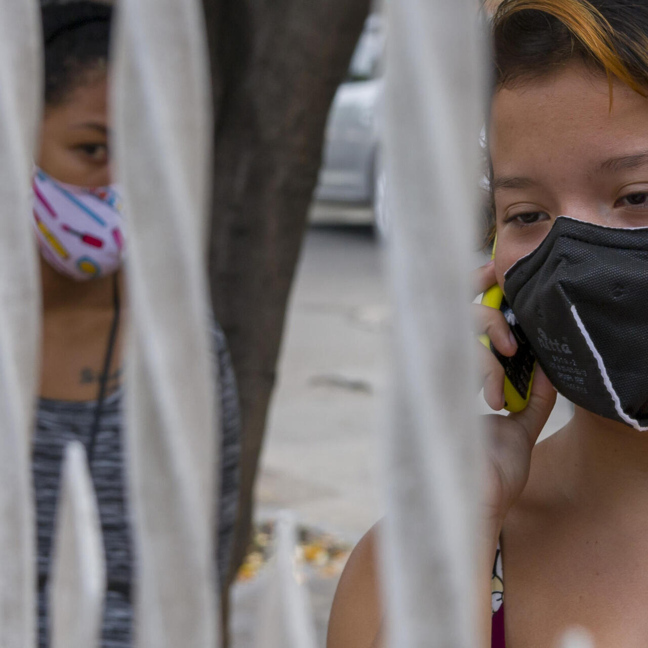 Venezuelan refugee women wait to enter an IRC health clinic on the Colombia/Venezuela border during the COVID-19 pandemic in 2020.