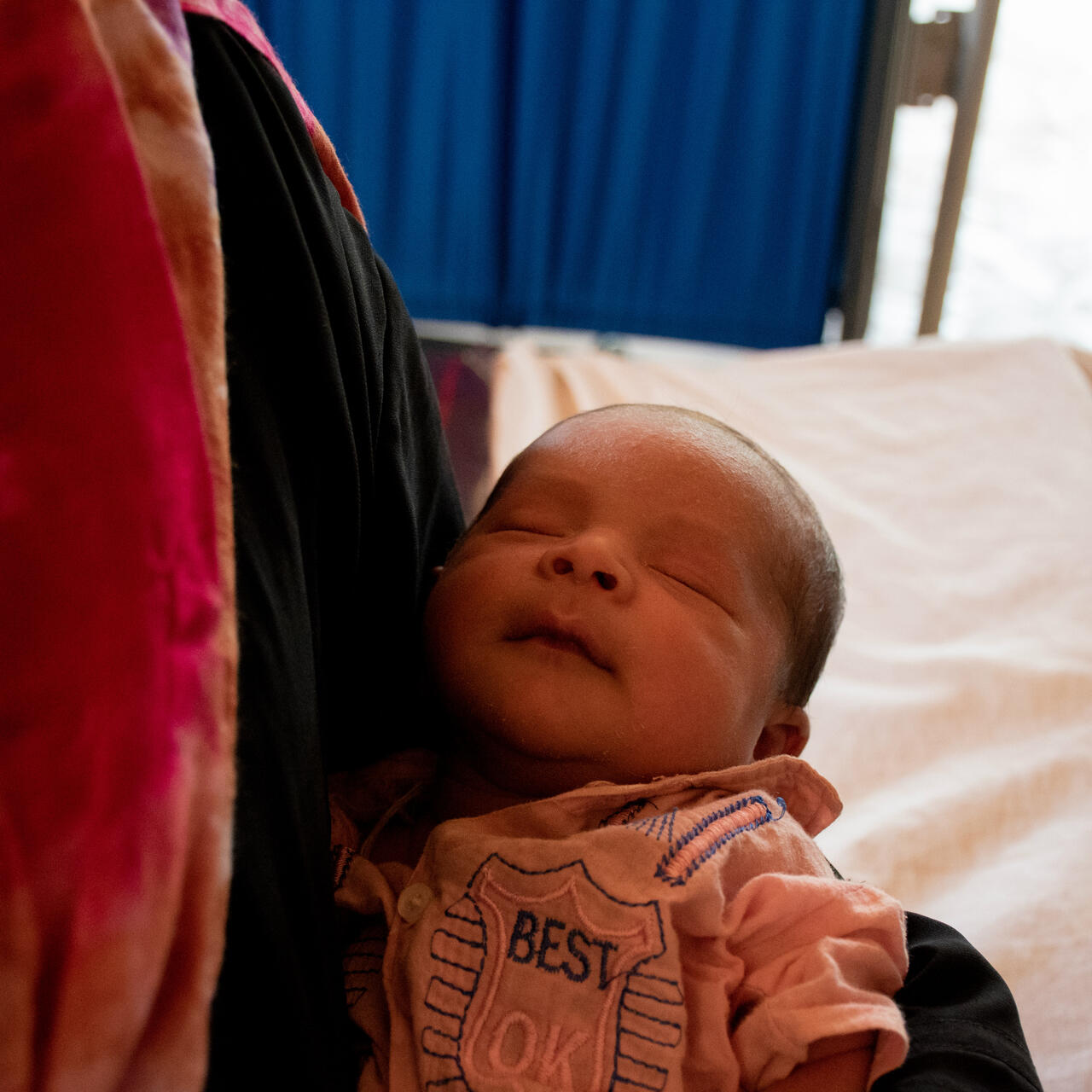 A four-day-old Rohingya boy in his mother's arms at an IRC health center in Bangladesh
