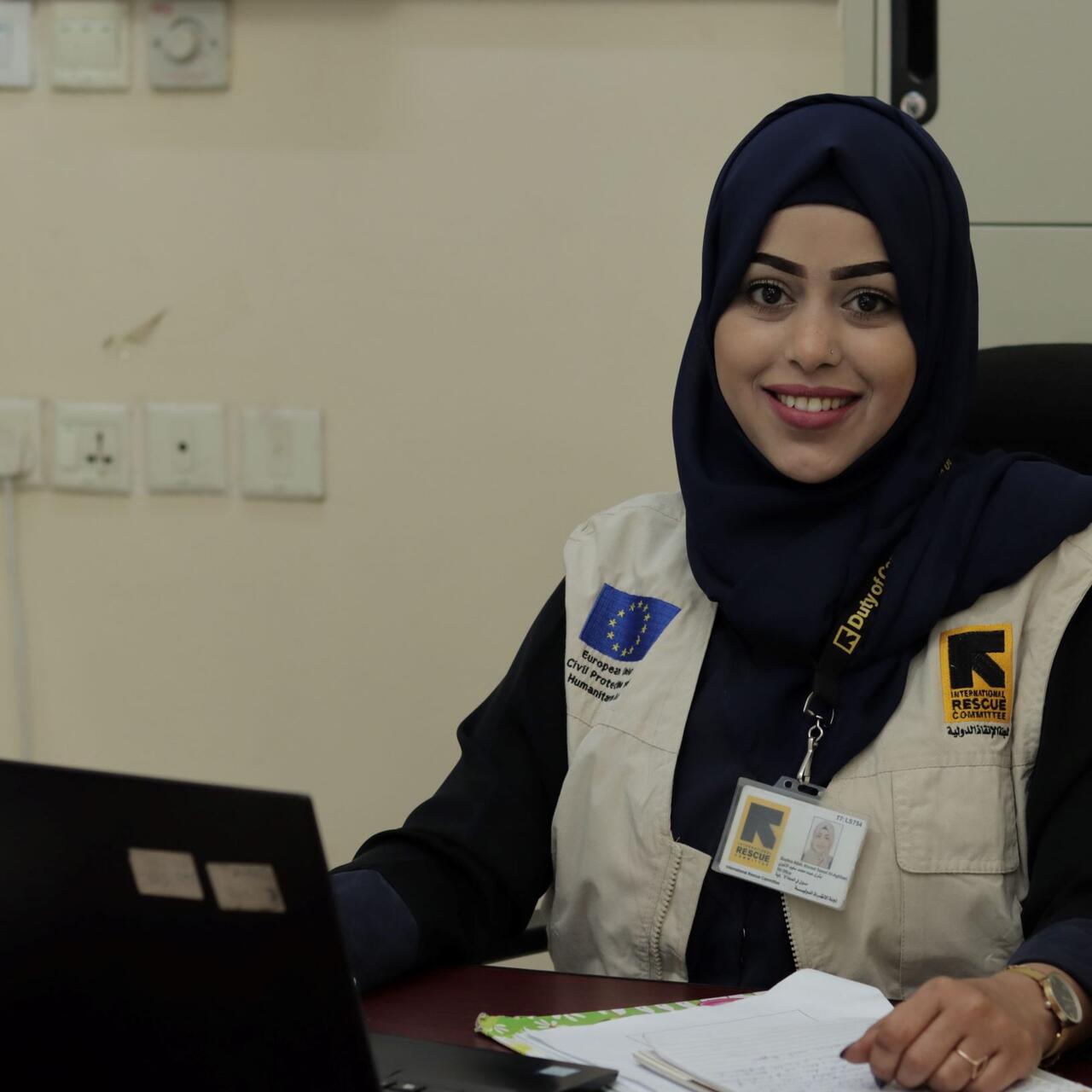 Bushra sitting at desk