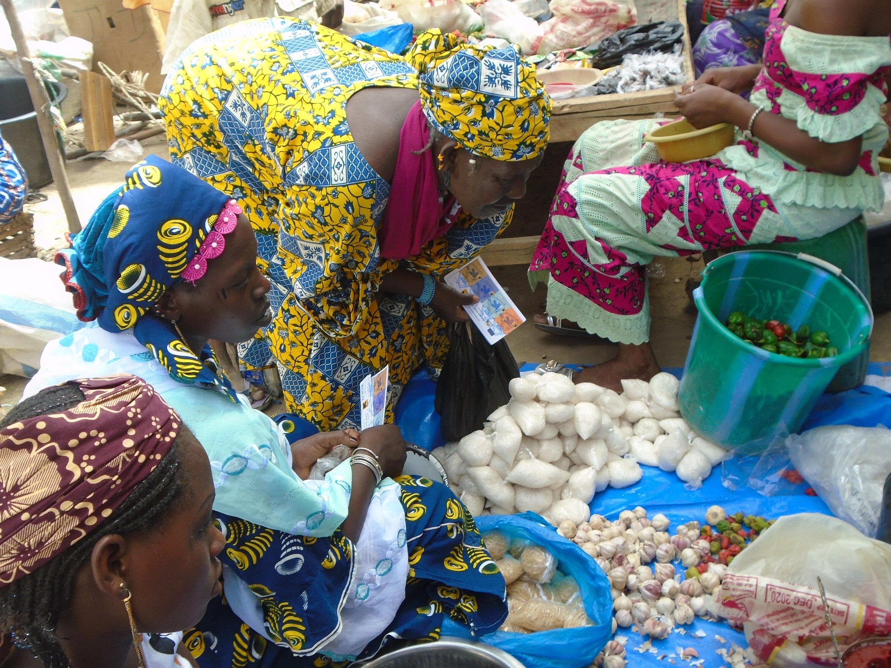 women exchange their food vouchers