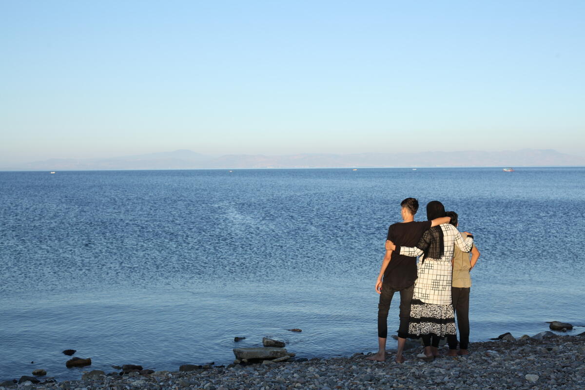 Iranian mother, Wahida with her two sons, Puria, 15, and Neema, 10, on the Greek island of Lesvos.