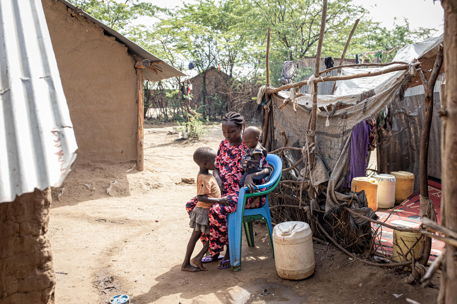 Judith, who has been living in a Kenyan refugee camp since 1998 sits with her two children and explains how drought has made life more difficult.