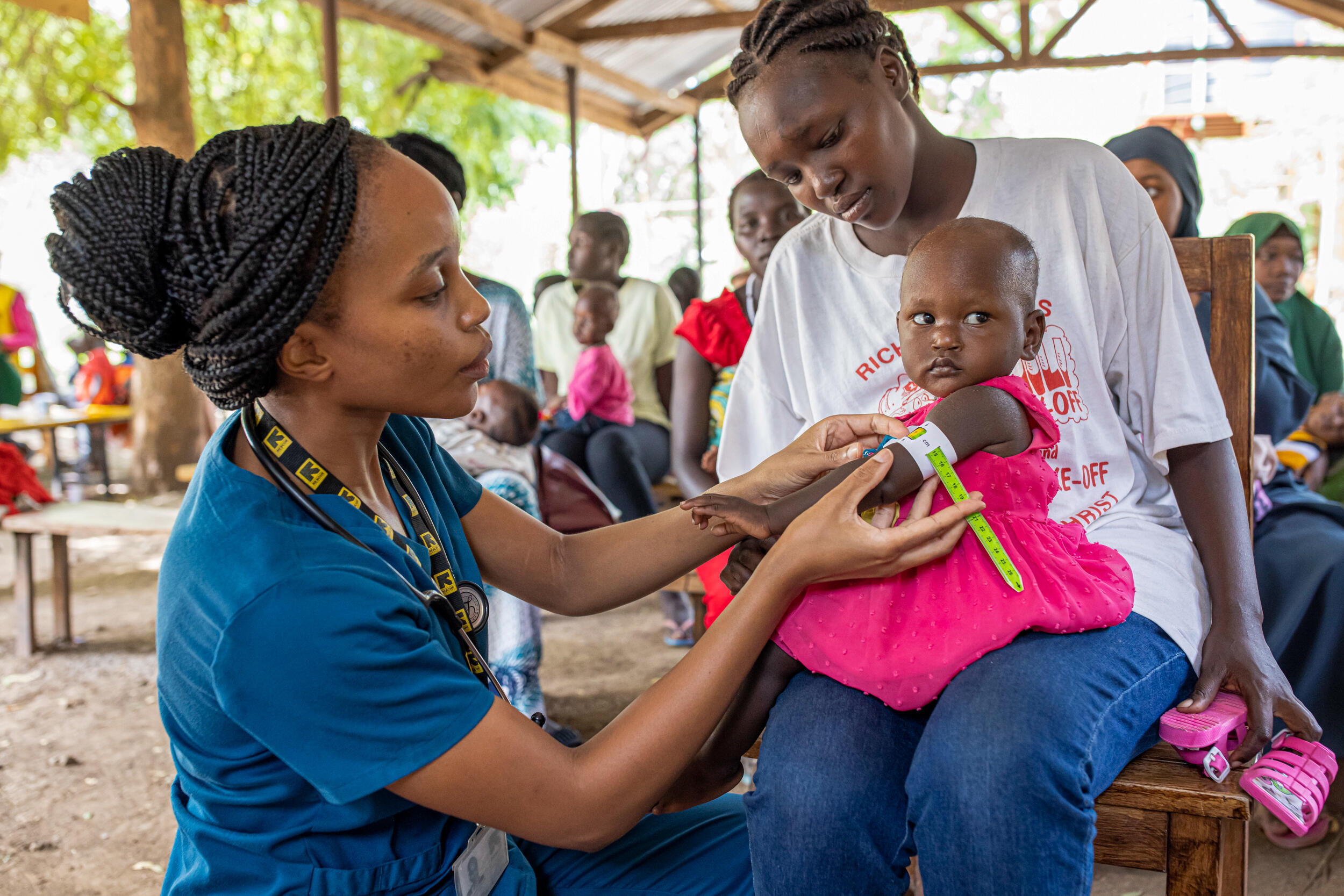 Dr. Sila Monthe, 29, health manager for IRC at Kakuma, checks Vanessa,1, for malnutrition at Locher Angamor Health Dispensary in Kakuma Refugee Camp.