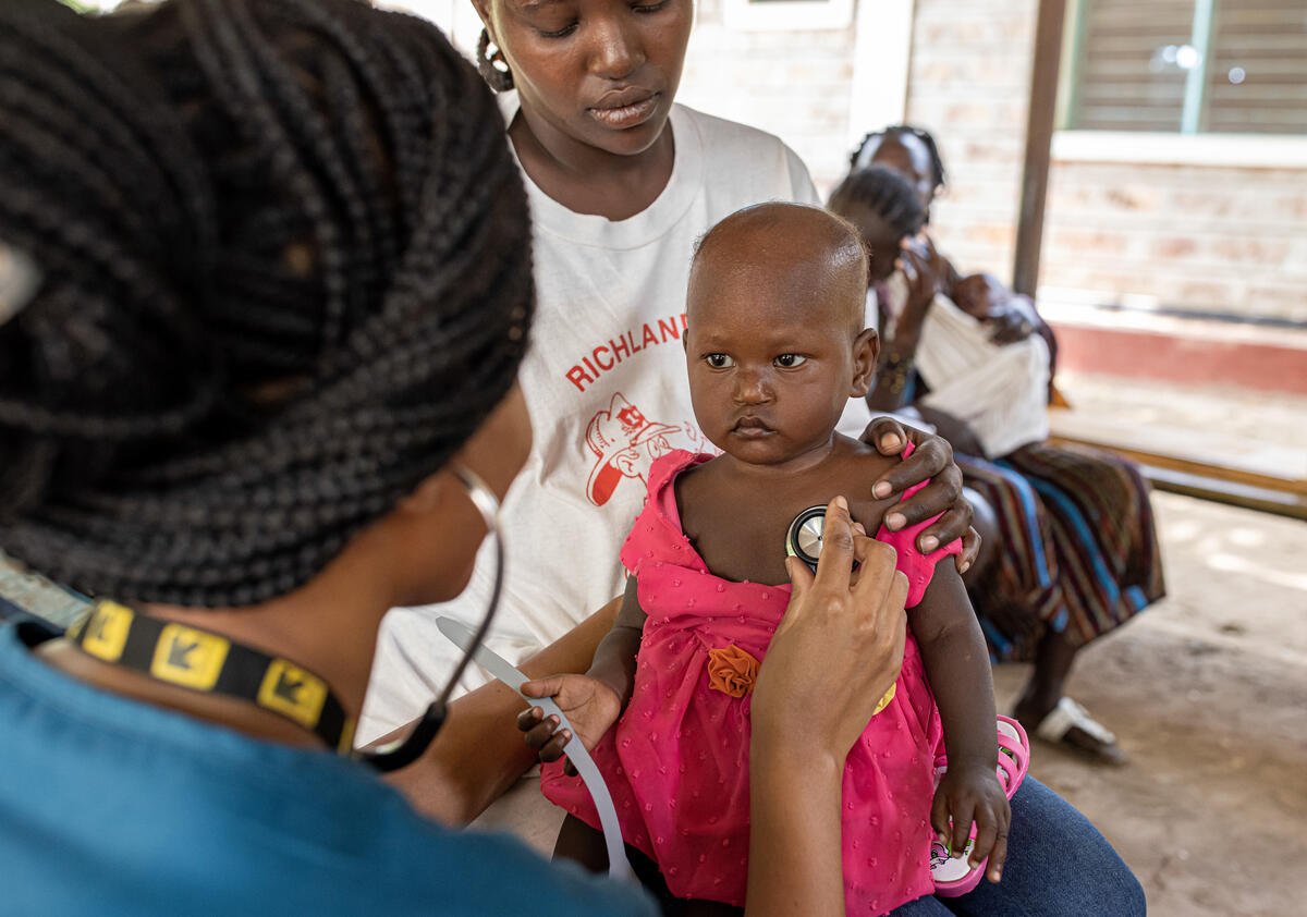 Dr. Sila Monthe, 29, health manager for IRC at Kakuma, checks Vanessa,1, for malnutrition at Locher Angamor Health Dispensary in Kakuma Refugee Camp
