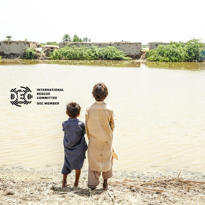 Children look across the floodwaters in Sindh province, Pakistan, where millions of people need urgent help. 