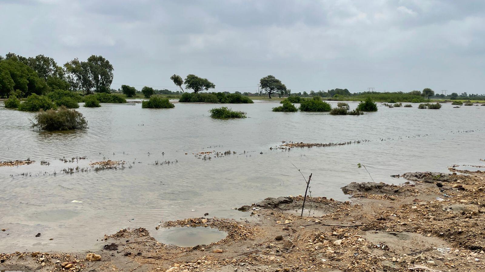 A road is completely submerged in water.