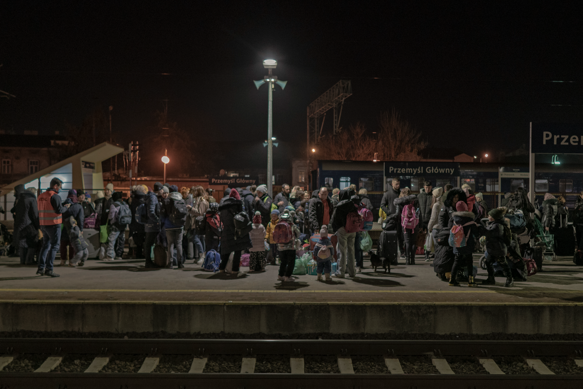 A large group of Ukranian refugees gather at a railway station in Poland, near the border with Ukraine.