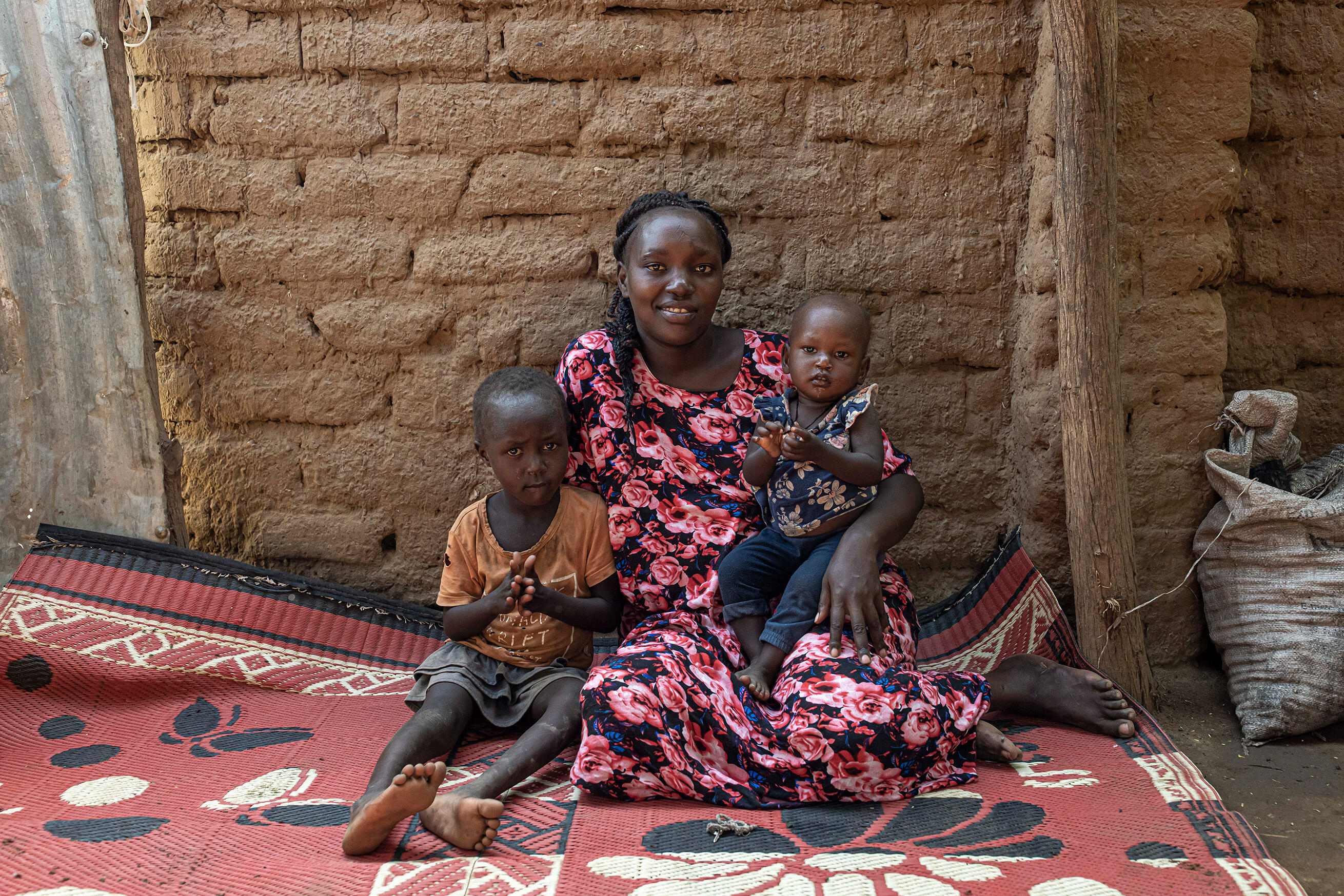IRC client Judith with her two children in Kenya
