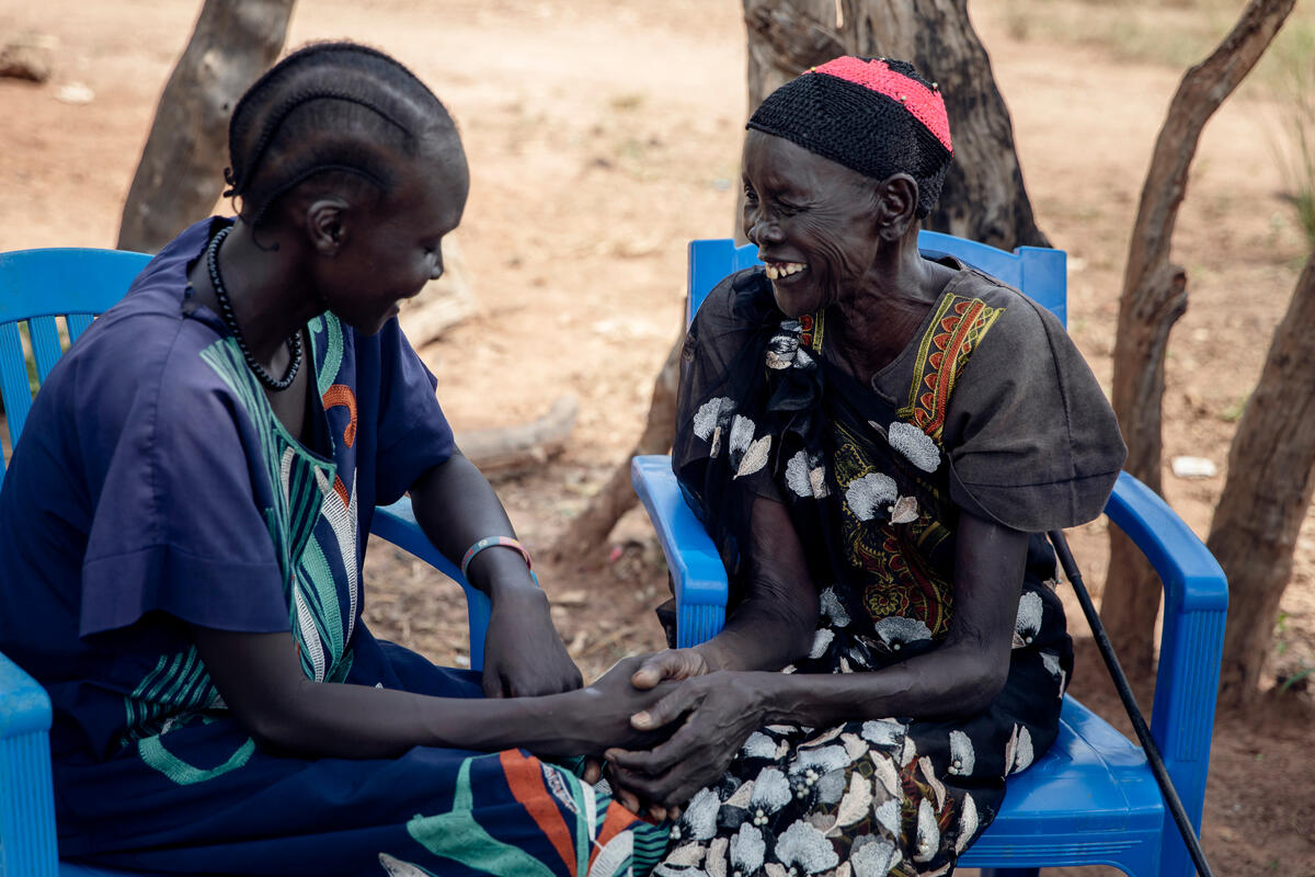 Veronica, 31, talks with her mother, Amou Makuei and support person, in Jamjang, South Sudan