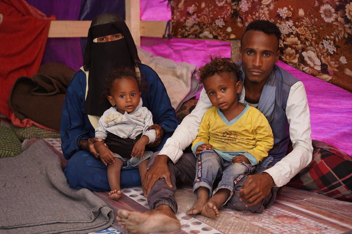 Yemeni couple Essam and Naziha with their 2 children inside a refugee camp