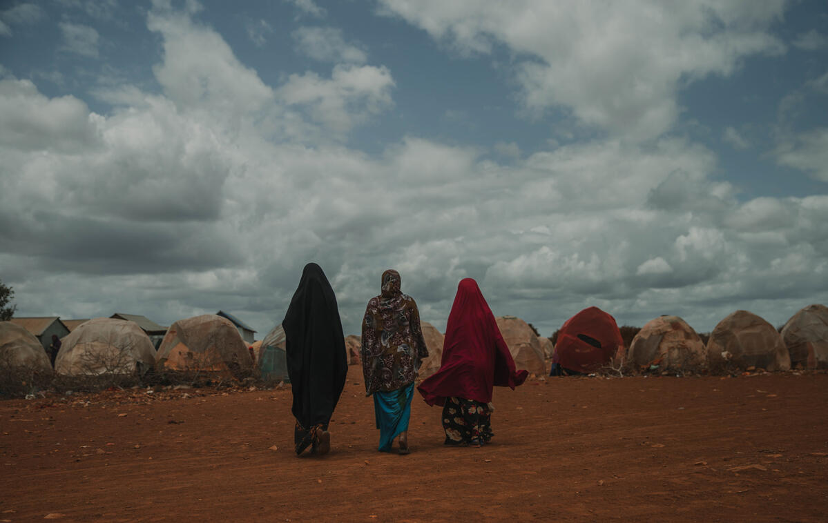 Women walk to their house, Torotorow IDP camp, Somalia.