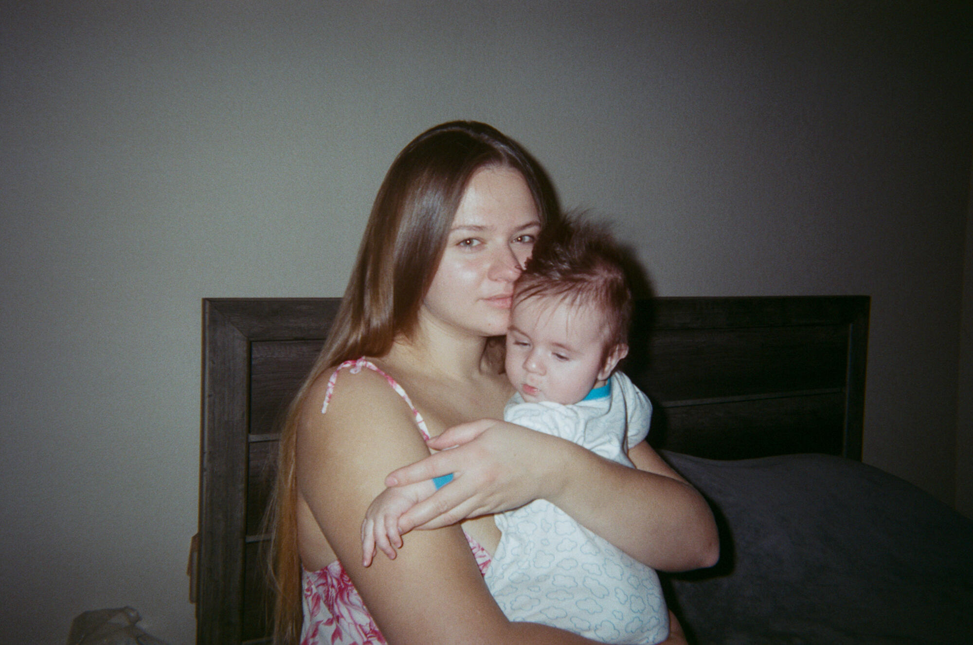 Olexandra holds baby Michael in her arms, facing the camera.