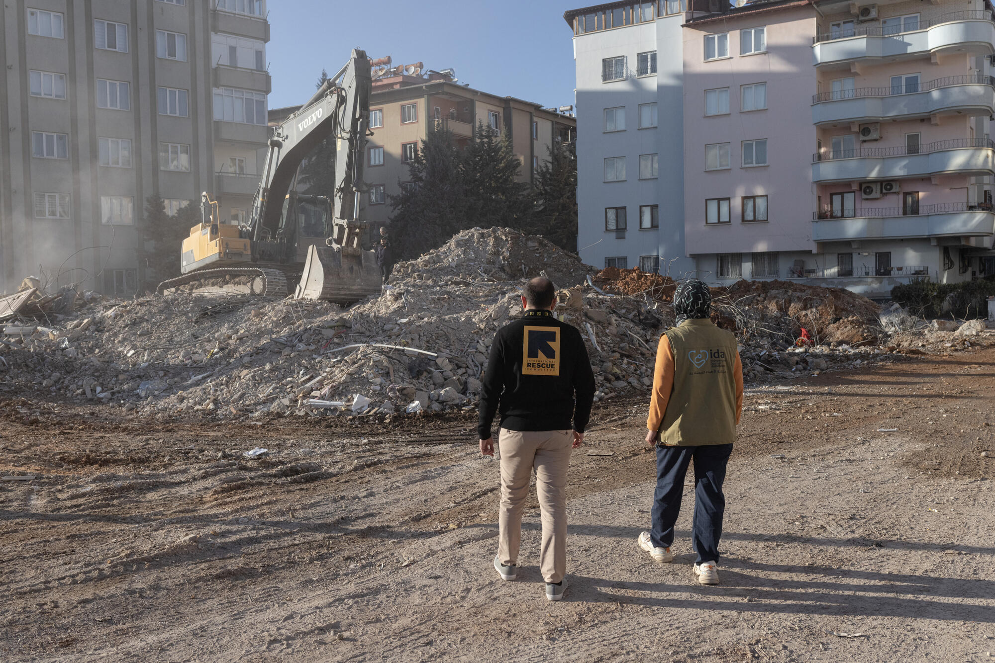 IRC staff amongst the rubble.