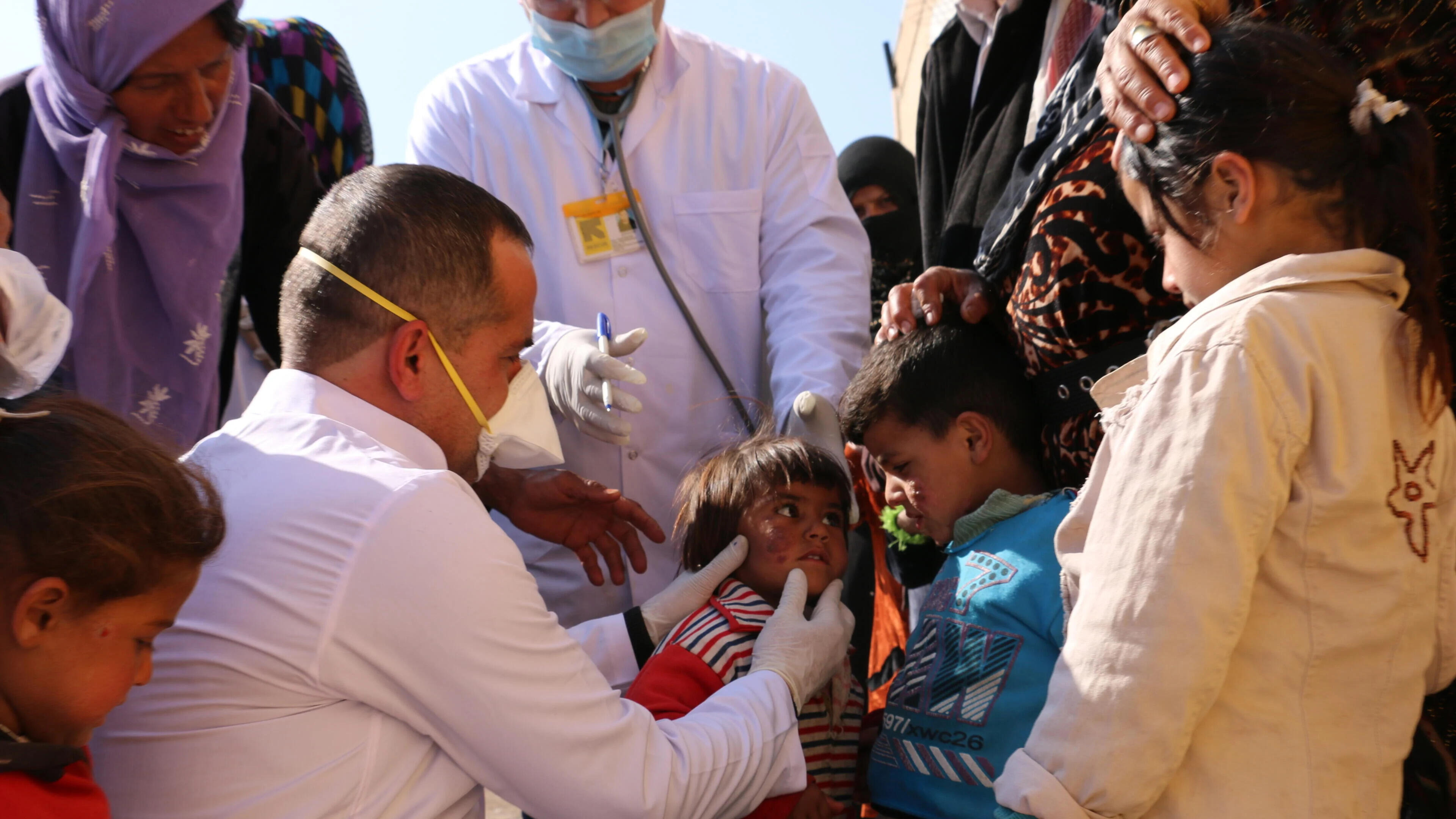 Doctor helping children