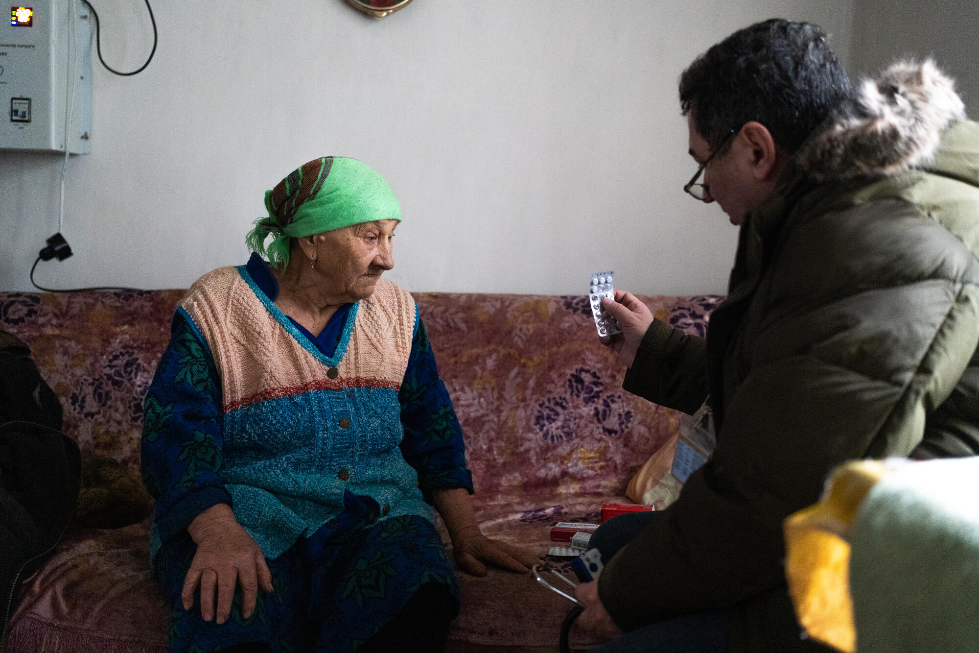 Dr. Oleg and community mobilizer Darina Holub pose with patient Lidia. 